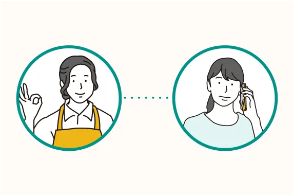 保護者と連絡している女性